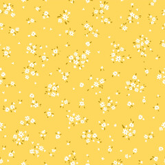 Vector illustration. Ditsy Floral seamless pattern of delicate tiny white flowers on a yellow background, blooming flowers. Liberty pattern for textiles, packaging, fabric, sublimation printing © Viktoriia Pushenko