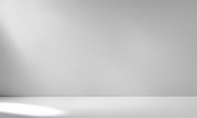 Abstract white background with soft white light and subtle gray shadows. Minimalist empty interior with copy space, ideal for creative studio backdrops, social media banners, product displays.
