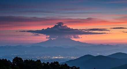 Majestic Mountain Landscape at Dusk with Vibrant Skies and City Lights