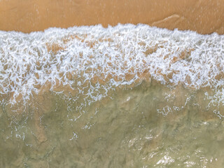 Top view Beautiful beach nature sea,Amazing landscape waves crashing on sand in summer background,Wide angle drone shot