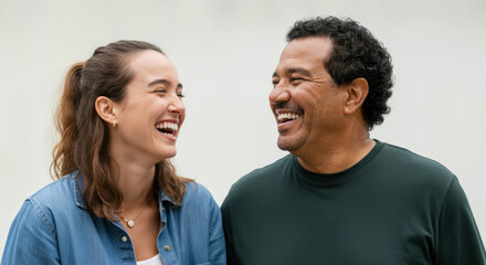 Fototapeta premium Hispanic man and caucasian woman laughing together