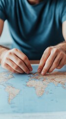 Hands of a Person Pointing on a World Map in Soft Blue Light