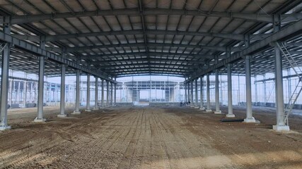 4k Video Aerial View of Large Factory Building Site Construction Plant Steel Frame Warehouse Progress