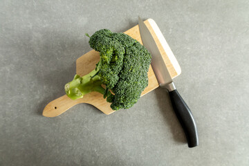 broccoli and knife on cutting board