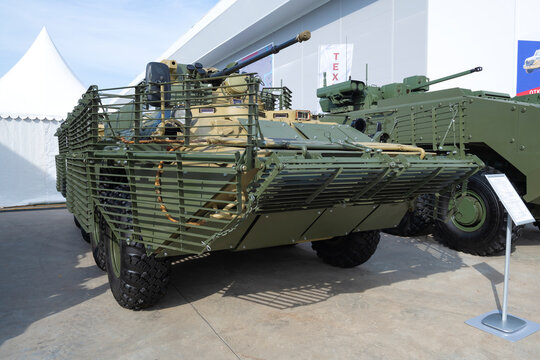 MOSCOW REGION, RUSSIA - AUGUST 19, 2022: Armored personnel carrier BTR-82AT with a set of protective lattice screens