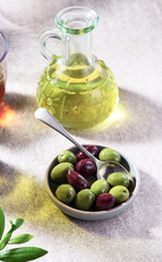 Olives and olives oil on a table