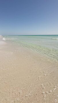 Gulf Islands National Seashore at Pensacola Beach, Florida.  Tropical summer beach vertical video.