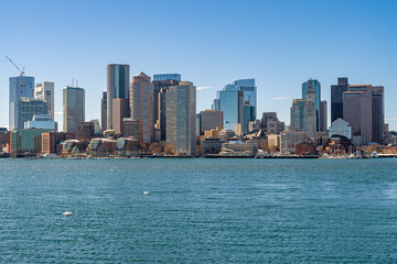 Naklejka premium View of Boston skyline and skyscrapers in February winter seen from Piers Park in Boston, MA