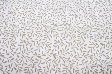 Fototapeta premium Close up leaf on whitefabric pattern background.