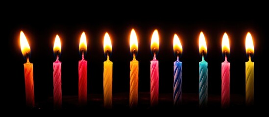 Colorful birthday candles dark background