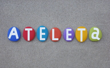 Ateleta, a small town on the left bank of the Sangro River included in the Maiella National Park, Abruzzo region, Italy, souvenir composed with multi colored hand painted stone letters over beach sand