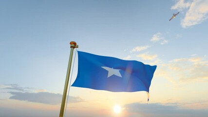 Flag of Somalia waving in the wind, sky and sun background. Somalia Video. 4K UHD. 