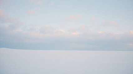 Serene Winter Landscape Pale Sky Over a Smooth Snowfield