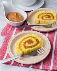 Roll cake or swiss cake filled with dulce de leche