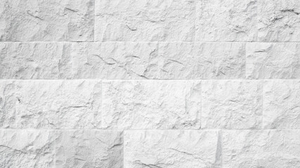 White textured stone tile background for copy space and exhibition. White stone wall tile seamless background and texture. Stone wall texture, white stone masonry texture as background.