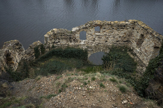Ruins of an ancient vysehrad fortress overlooking a calm vltava river