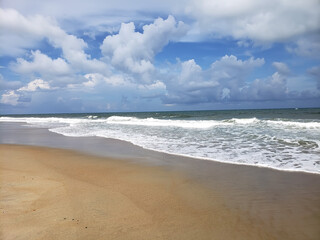 Deserted shore, waves and sky of the Atlantic Ocean