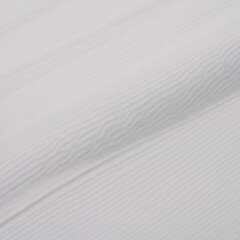 White cotton pique fabric serves as the image backdrop