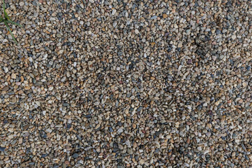 small multicolored pebbles forming a textured ground cover background copy space . Vysocany district prague 9