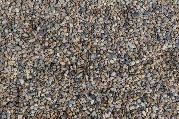 small multicolored pebbles forming a continuous surface background copy space . Vysocany district prague 9