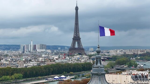 French flag on Grand Palais dome and Eiffel Tower (Tour Effeil) in Paris, France