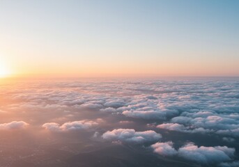 A golden sunrise illuminates a sea of clouds, casting a warm glow over a serene and vast aerial landscape.