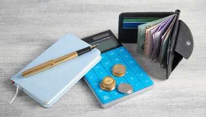 Wallet with a coins on the table. Finance