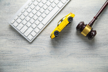 Computer keyboard, toy car and judge gavel.