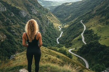 Naklejka premium In the Kabardino-Balkaria Republic, a blonde girl takes in the view of a beautiful gorge