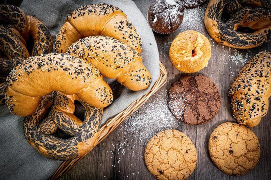 Fresh baked bread, various delicious freshly baked bread on white background, copy space. Variety of artisan bread composition, top view