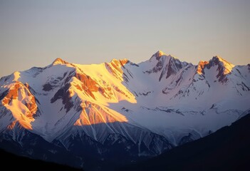 Fototapeta premium Golden hour illuminates snow-capped peaks, majestic mountain range casting long shadows, view, cold