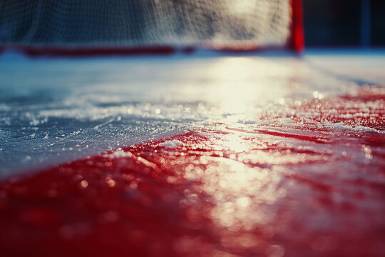 Empty hockey net with glistening ice surface. Perfect for goal moments, training scenes, and dramatic buildup.

