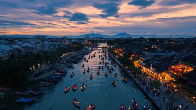 Drone video Hoi An, Vietnam in Quang Nam Province is a popular tourist destination, with colorful lantern boats sailing along the river at night.