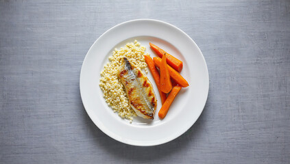 Grilled fish fillet with couscous and carrots