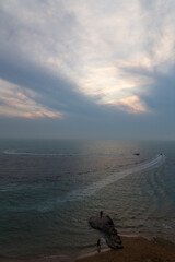 Tranquility meets motion, boats carve their paths across the vast sea as the sky paints a serene,...