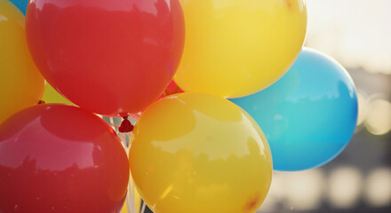 Cluster of pastel balloons, in pink, blue, and purple, for celebration and parties