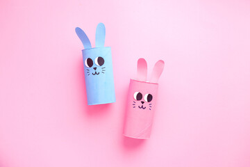 Holiday easy DIY craft idea for kids. Toilet paper roll tube toy's cute rabbit's on minimal background banner. Creative Easter, Christmas decoration eco-friendly, reuse, recycle handmade concept