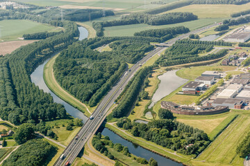 Aerial view of industrieterrein Moerdijk showcasing lush landscapes, highways, and industrial...