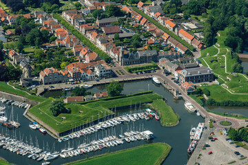 Exploring the vibrant architecture and scenic marina of Willemstad, a charming coastal town in the...