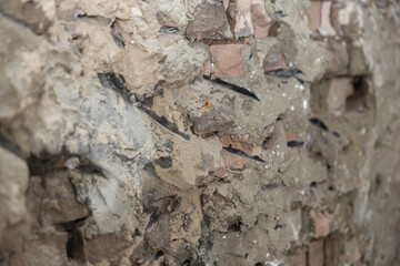 Old exterior brick wall. Old destroyed wall structure in vintage style. Abstract background texture texture. Old exterior wall. Abstract wall with painted grunge background.
