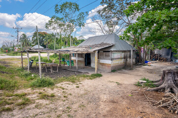 Fototapeta premium Old wooden building on the side of the highway in Limones, Quintana Roo, Mexico