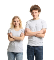 Young woman and man wearing blank t-shirts on white background. Mockup for design