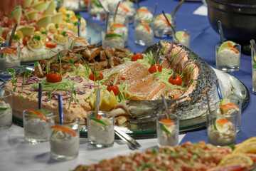 Exquisite seafood spread featuring fresh fish, shellfish, and appetizers at a festive gathering setting