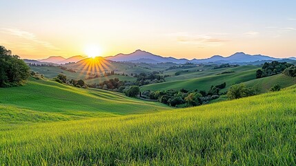 Sunrise Over Rolling Green Hills and Distant Mountains
