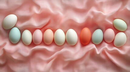 Pastel Colored Easter Eggs Arranged on Soft Pink Fabric