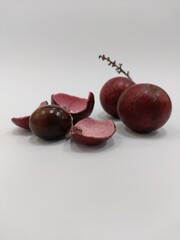 red longan, kelengkeng merah, dragon eye fruit. closeup. isolated on white background
