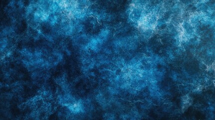 Fototapeta premium A deep blue textured background with subtle lighting effects creating depth and richness