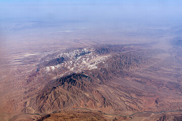 Snow-capped mountain ranges in China. Tien Shan or the Himalayas, beautiful mountains from a high...