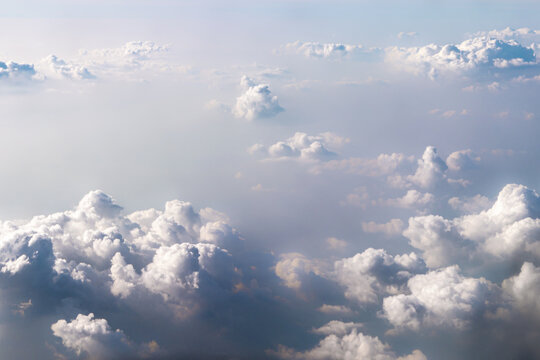 The background is textured dramatic blue-white clouds in the sky, the view from the window of a samsolet. Fantastically beautiful natural background, a peaceful and peaceful scene of real nature.