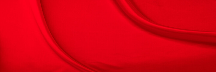 Black red satin dark fabric texture luxurious shiny that is abstract silk cloth background with patterns soft waves blur beautiful.